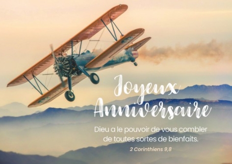 Carte postale anniversaire avec verset avion biplan au-dessus des collines